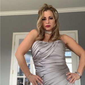 Beautiful satin silver Jordan size 8 sleeveless formal gown.